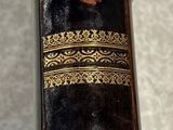 a black and gold case sitting on a table