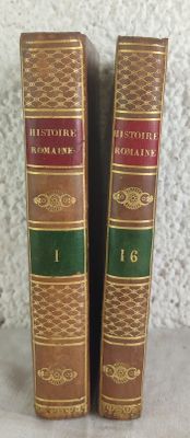 two books are sitting on a table next to each other