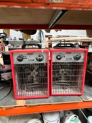 two ovens that are sitting on a shelf in a store