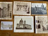 many old photos of a building on a table