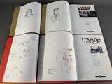 three pages of a book that are open on a table