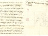un vieux document sur lequel figurent une lettre manuscrite et la photo d'un homme coiffé d'un chapeau