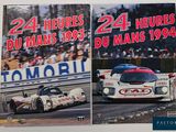 two book covers of racing cars on display on a table