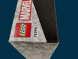a box of legos sitting on top of a blue surface