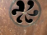 a close up of a metal door with a hole in it