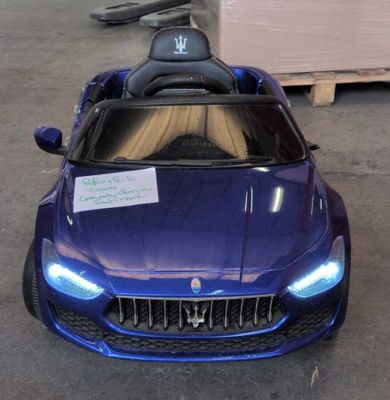 a blue toy car that is parked in a garage