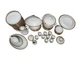 an image of a group of white and gold dishes and cups
