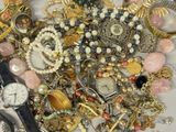 a pile of assorted jewelry on a table