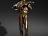 a bronze statue of a woman holding a mandolin
