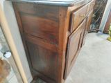 a bathroom vanity with a sink and a mirror