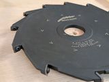 someone is using a circular saw to cut a piece of wood with a circular blade