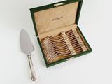 silverware in a green box with a green handle and a set of forks