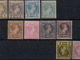 a close up of a group of stamps on a black surface