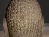 a statue of a head that is sitting on a table