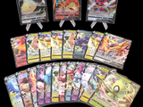 a lot of pokemon cards on a black background