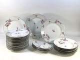 a lot of plates that are sitting on a table