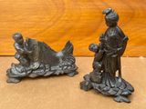 paire de figurines anciennes en fonte représentant une femme et un poisson