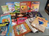 many children ' s books that are on a table