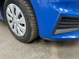 a close up of the front bumper of a blue car