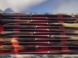 six knives sitting in a tray on a table