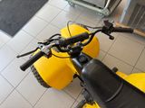 a motorcycle that is sitting on the floor in the room