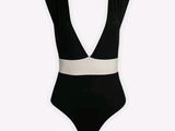 a black and white one piece swimsuit on a mannequin mannequin mannequin mannequin mannequin mannequin mannequin mann