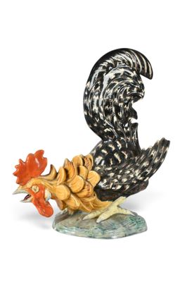 a figurine of a rooster and a chicken on a rock
