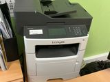 a printer that is sitting on top of a desk