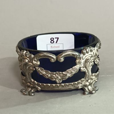 an ornate silver and blue bowl with a price tag on it
