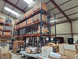 a large warehouse filled with lots of boxes and shelves