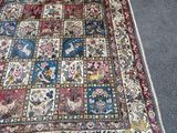 a rug on the floor with many different designs on it