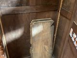 a wooden door in the corner of a room