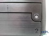 a close up of a metal object with a button on it