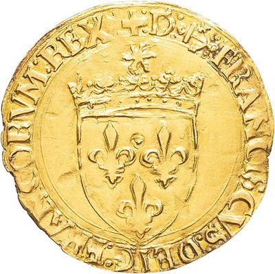 a close up of a gold coin with a crown on it