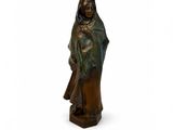 bronze statue of a woman holding a child on a white background