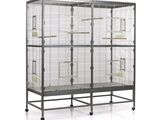 an image of a bird cage with two birds in it