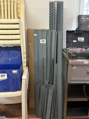 a stack of boxes and a chair in a room