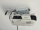 a projector mounted on the ceiling of a room