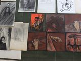 many different pictures on the wall of a bathroom
