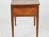an old wooden table with a drawer on top of it