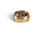 an image of a gold ring with a blue stone in the center