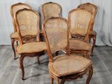 lot de quatre chaises de salle à manger anciennes à dossier en rotin, de fabrication française