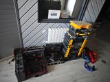a lot of tools that are sitting on the floor