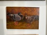 two birds that are standing next to each other on the wall