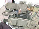 many different types of military gear laid out on the floor