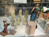 many figurines of jesus and other religious figures on display