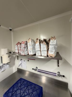 many bags of food on the shelves in the kitchen
