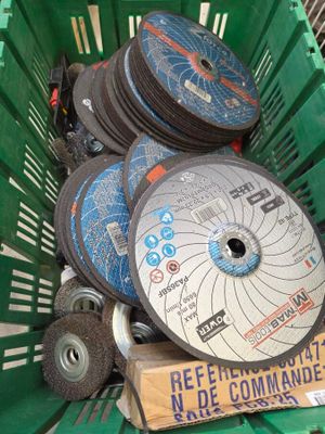 a green basket filled with different types of discs