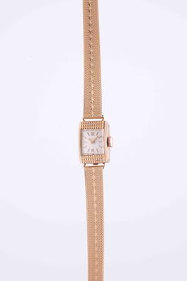 a close up of a wrist watch on a white background