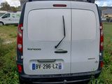 a white van that is parked in the grass